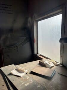 Paperwork on interior table of old caboose.