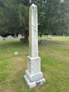 Obelisk tombstone in graveyard.